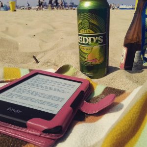 a kindle e-reader on the beach