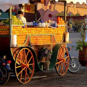 an orange juice cart in marrakech