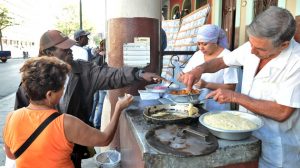 vendors selling food in the street in havana cuba