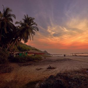 a beach shack at sunset in goa india