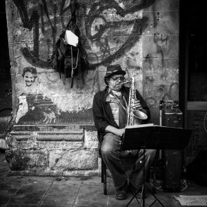 a street musician performs in the historic centre mexico city