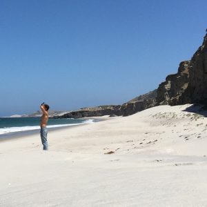 a sunbather on a white sand beach at channel islands national park california