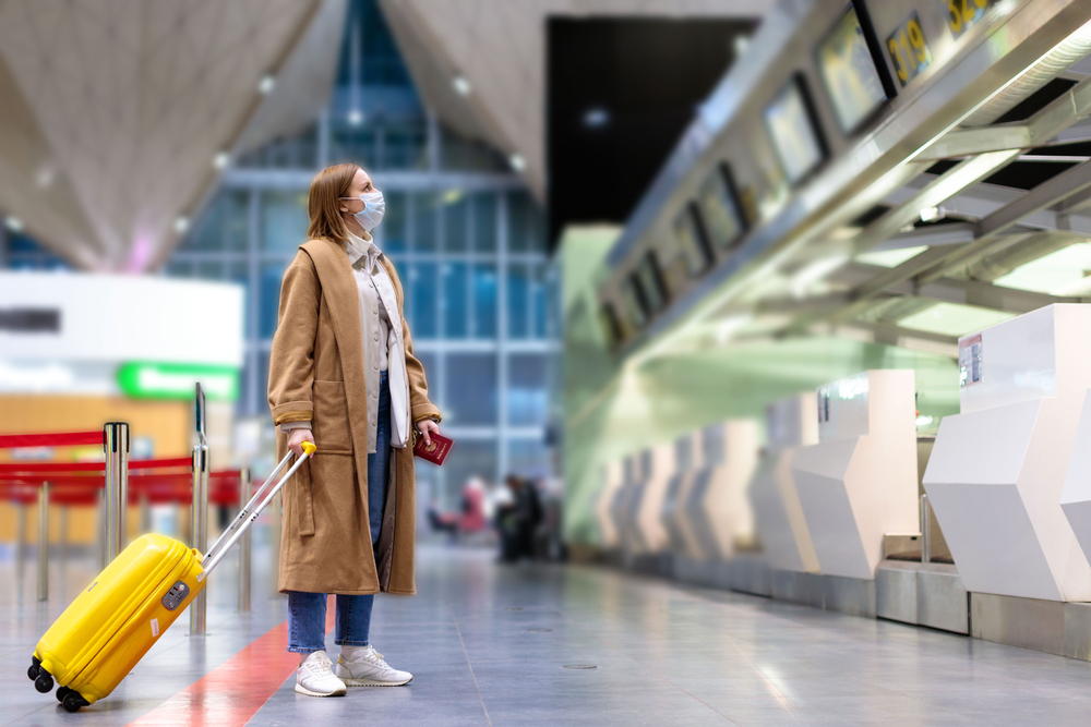 Woman in airport with mask