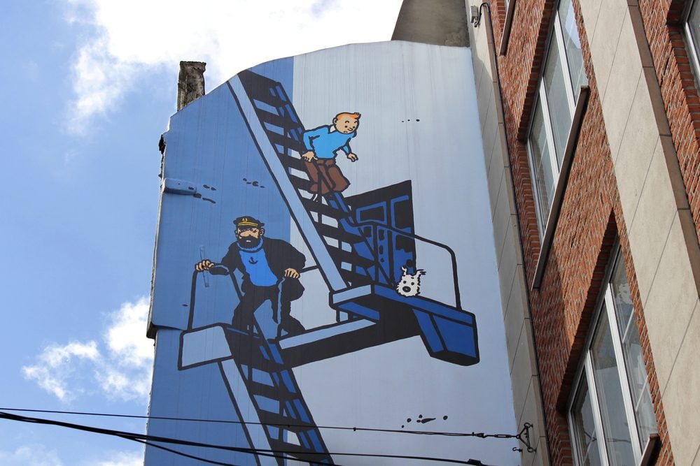 Tintin escaping down a fire escape mural