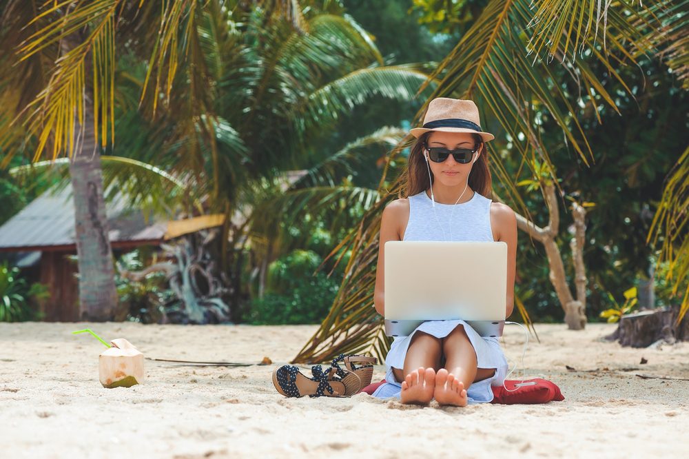 Woman working on the beach