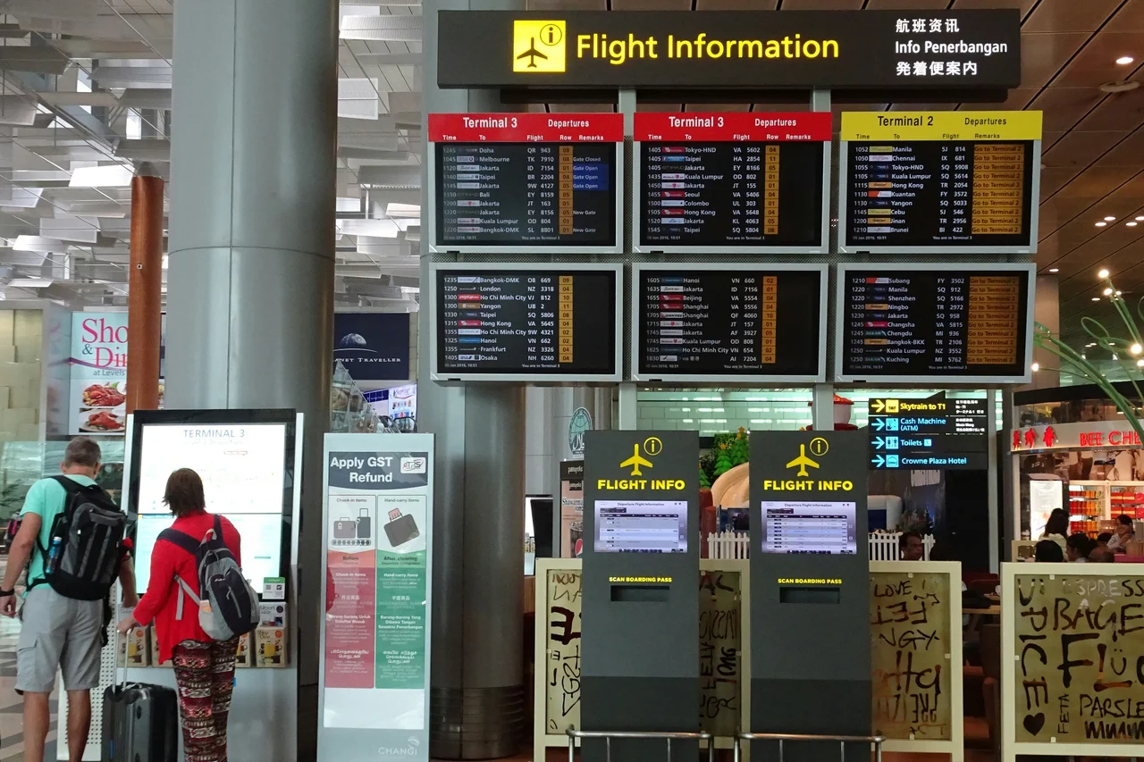 Traveler checking passport details for an easyJet flight